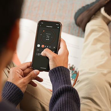 man using smartphone to check Quilt settings